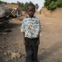 Four year old Malian boy Drissa Sangare poses for a photograph in the street in which he lives in Diabaly, Mali 26 January 2013. This photograph is part of a picture package of portraits showing children living along the same street in the small rice growing community of the northern Malian town of Diabaly who in the month of January 2013 lived through a rapid chain of events in the Malian war.