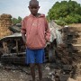Eleven year old Malian boy Jean Marc Dako poses for a photograph in the street in which he lives in Diabaly, Mali 26 January 2013. This photograph is part of a picture package of portraits showing children living along the same street in the small rice growing community of the northern Malian town of Diabaly who in the month of January 2013 lived through a rapid chain of events in the Malian war.