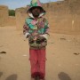 Four year old Malian boy Mohamad Sangare poses for a photograph in the street in which he lives in Diabaly, Mali 26 January 2013. This photograph is part of a picture package of portraits showing children living along the same street in the small rice growing community of the northern Malian town of Diabaly who in the month of January 2013 lived through a rapid chain of events in the Malian war.