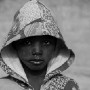 Four year old Malian boy Mohamad Sangare poses for a photograph in the street in which he lives in Diabaly, Mali 26 January 2013. This photograph is part of a picture package of portraits showing children living along the same street in the small rice growing community of the northern Malian town of Diabaly who in the month of January 2013 lived through a rapid chain of events in the Malian war.