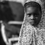 Four year old Malian girl Uomou Coulibaly poses for a photograph in the street in which she lives in Diabaly, Mali 26 January 2013. This photograph is part of a picture package of portraits showing children living along the same street in the small rice growing community of the northern Malian town of Diabaly who in the month of January 2013 lived through a rapid chain of events in the Malian war.