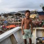 Twelve year old Filipino boy Shan Boklatan poses for a portrait in the super typhoon devastated city of Tacloban, Leyte province, Philippines 17  November 2013. Shan survived the storm by taking shelter in a nearby school but had his home destroyed in the Anibong area.
