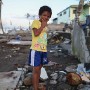 Eleven year old Filipino boy Francis Cowaha poses for a portrait in the super typhoon devastated city of Tacloban, Leyte province, Philippines 17  November 2013. Francis, living close to the waters edge, took refuge in a third floor building and survived with his family but their house was destroyed.