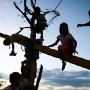 Filipino children play amongst rubble in the super typhoon devastated city of Tacloban, Leyte province, Philippines 17  November 2013.