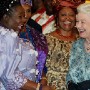 Queen of England Elizabeth II (R) shares a laugh with the Director General of the Nigerian stock exchange, Dr Noidi Okereke Onyiwke (L in purple) at a reception for the Queen at the State House in Abuja, Nigeria Wednesday 03 December 2003. The Queen of England, Elizabeth II, visited Nigeria in December 2003 which was the first state visit there since 1956.