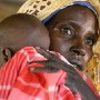 A Sudanese IDP (Internally displaced people) mother waiting to see a doctor for her sick baby at the MSF (Medicines Sans Fronteir) clinic in the  Al Hameidia IDP camp,West Darfur, Sudan. The Sudanese government Monday, 29 November 2004, ordered the expulsion within 48 hours, of two senior international aid workers claiming the two who work for Oxfam and Save the Children had broken laws on non-intervention in Sudan's political, ethnic or sectarian issues. 