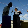 South African women collect water from a communal tap in the impoverished suburb of Masiphumelele in Cape Town, South Africa Wednesday, 22 March 2006. A United Nations (UN) report presented at the World Water Forum being held in Mexico concludes Africa's water systems need an annual investment of approximately 20 billion US dollars over the next two decades as 300 million Africans lack access to safe drinking water. The UN added that failed policies are the main reason why around 20 percent of the world's population lack access to clean water. The World Water Forum in Mexico ends today which is World Water Day with this years theme of 'Water and Culture'.  