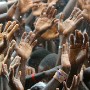 Thousands of Liberians scream for water at a mass rally for their presidential candidate and football star George Weah in Monrovia, Liberia Saturday 08 October 2005. This image was part of a portfolio that won best news portfolio of 2005 for EPA West Africa chief photographer Nic Bothma in the Fuji Africa Press Awards anounced Thursday 17 August 2006.  