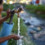  A South African boy drinks water from a communal clean water source next to a contaminated river in Masiphumelele, Cape Town, South Africa 12 March 2010. The communal taps in many poor areas are often near contaminated water and pose serious health risks. Some analysts predict that by 2025 more than 1.8 billion people will  live in areas where uncontaminated water is in short supply. World Water Day is marked on 22 March 2010.  