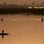 Malian fishermen work from their pirogues at dawn in the Niger river, Africa's third longest river, in the capital Bamako, Mali 27 April 2007.  Mali, twice the size of France, is one of the world's poorest countries ranking 175 out of 177 in the United Nations Development Programme human development report. Eight candidates, including one woman and the current head of state Amadou Toumani Toure are seeking to win presidential elections on 29 April 2007. 
