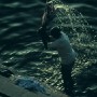 A man washes clothes in the Ganges river, Varanasi, India 1997.