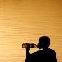 A Sudanese girl drinks water she collected from the river Nile whilst sitting on a rock at sunset in the Nile river in Khartoum, Sudan Sunday 10 October 2004. There are an estimated 4 million internally displaced persons (IDP) in Sudan, with almost half of those living in official camp and squatter areas in greater Khartoum. IDP's make up to 40% of Khartoum's total population.  Sudan, the largest country in Africa, is one of the least developed areas in the world. 