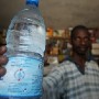  A Senegalese man sells bottled drinking water from Europe at his store in Nordfoire Senegal Monday 22 March 2004. Today is international World Water Day 2004 and focuses on the theme: Water and Disasters. Tap water is not safe to drink in Senegal as with most African countries and most people rely on bottled water or boil the tap water before drinking it. There are only 14 countries in the world where the water from municipal taps is safe to drink.  