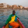 30 year old Modu Samba, a fisherman from Senegal, heads out to sea from the 400 year old fishing village of Ngor, Dakar, Senegal, 14 April 2010. Heavy fishing by international companies has put great pressure on traditional fishing communities. Highlighted as one of the main causes for the lack of fish today is the deals that have been struck over the last 50 years between the governments of West African nations and the countries owning large fishing fleets from Europe and Asia. These deals have benefitted the West African governments financially but not the people they govern. The foreign countries enjoying the fertile fishing grounds have been accused of overexploiting the resources and ultimately depleting the fishing stocks once the livelihood of the artisanal fishermen. Often in traditional fishing communities, fish are an important food source, and fishing is a way of life and basis for local cultures. As fish populations decline, stocks move offshore, making them inaccessible to small-scale, artisanal fishermen who do not have equipment to access offshore stocks.  