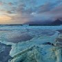 Sea foam caused by a churned up ocean due to high winds and rough seas washes up the beach in Kommetjie, South Africa, 23 May 2011. Gale force winds and high seas have been lashing the Western Cape coast following the onset of winter cold fronts.  