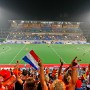Dutch fans celebrate the 1-0 goal from the Netherlands during the preliminary pool B match against great Britain in the men's Field Hockey competition at the Beijing 2008 Olympic Games, Beijing, China, 13 August 2008. The Netherlands defeated Great Britain 1-0
