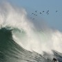 Big wave surfer Grant Baker from South Africa surfs a wave at an offshore reef know as the 'Dungeon' off Cape Town, South Africa 19 June 2007. Local and international big wave surfers enjoyed huge swells created by a severe cold front moving through the country at present. Surfers are practicing for the annual Big Wave Africa competition which waits for the winters biggest swells before the contest is run.