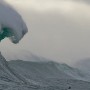 Jake Kolnik from South Africa has a wave break onto him as he surfs a  at an offshore reef in Cape Town, South Africa 21 August 2011. Surfers using waverunners to tow into the Cape's biggest winter swells are eligble for the Rebel Sessions Awards which recognise the best surfing over a season of big waves in Cape Town, South Africa.