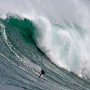 epa01075456 South African big wave surfer Andy Marr surfs a wave at an offshore reef known as Dungeons off Cape Town, South Africa, 24 July 2007. Back to back cold fronts sweeping into the country at the moment have created huge waves for surfing. The waves are too big to paddle into so the surfers use waverunners to tow them into the fast moving swells. The surfers ride custom made surfboards that are heavier than normal and have footstraps to help control the board at high speeds.  EPA/NIC BOTHMA