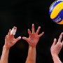 Hands of players as they vie for the ball during the Women's Volleyball Preliminary round pool B match between Brazil and Serbia